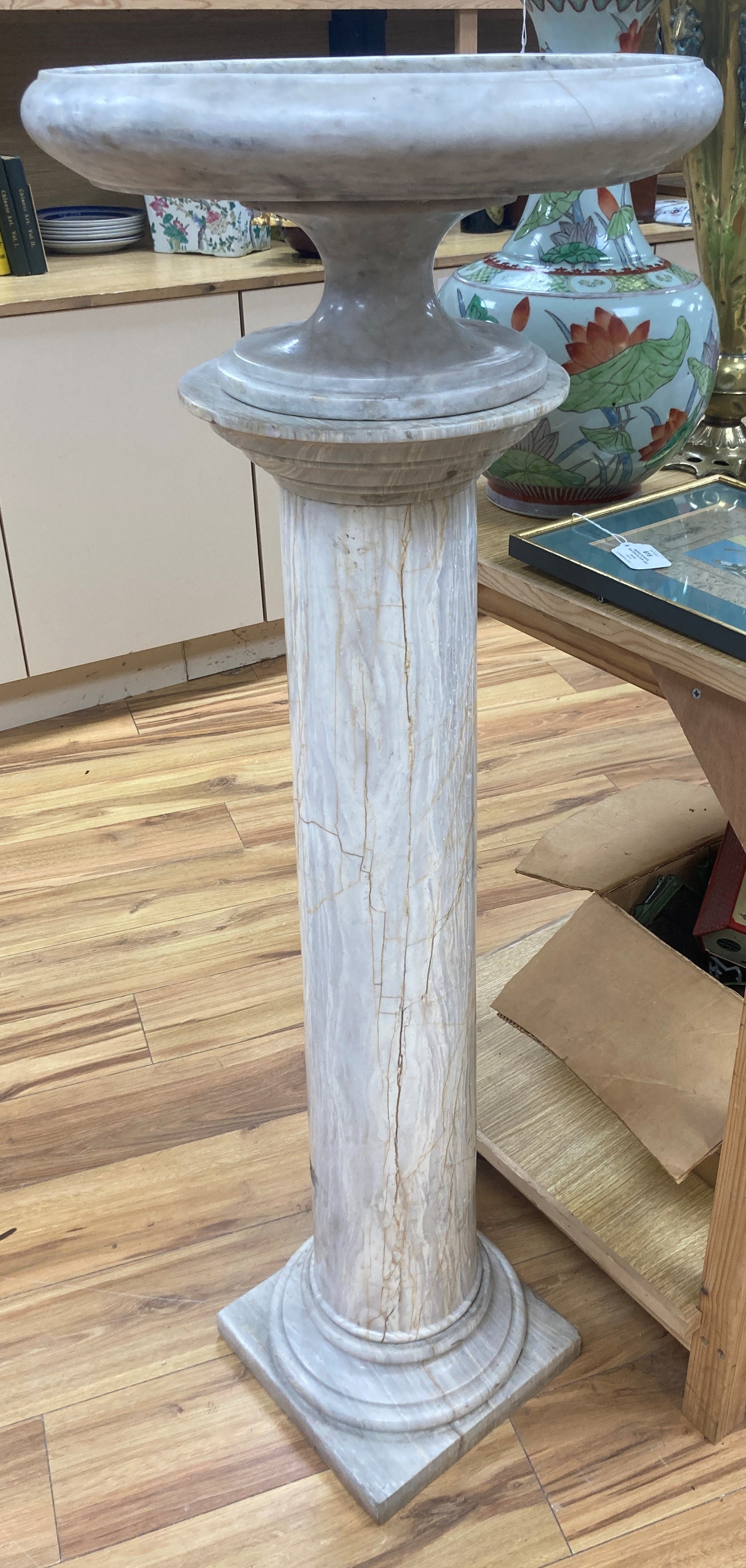 A white marble tazza on associated column stand 120cm high (combined) 43cm diameter (tazza)